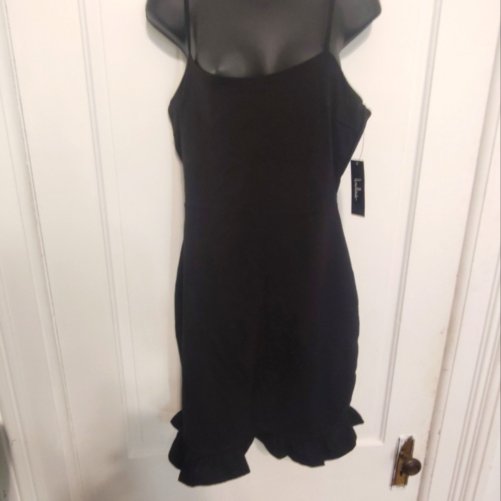 Lulu's stretchy bodycon black minidress with fringe detail on hem